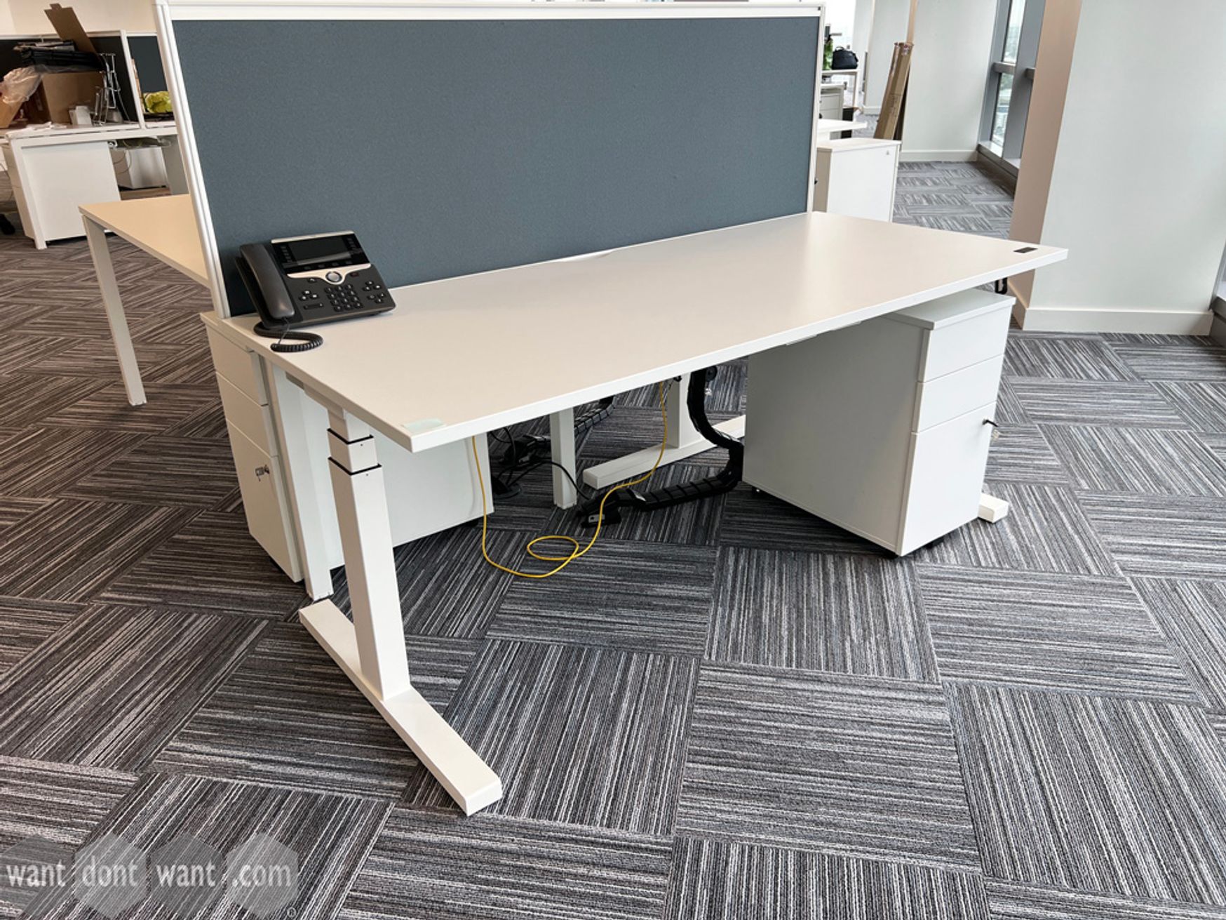 Used 1800mm Senator height-adjustable desks with cable trays