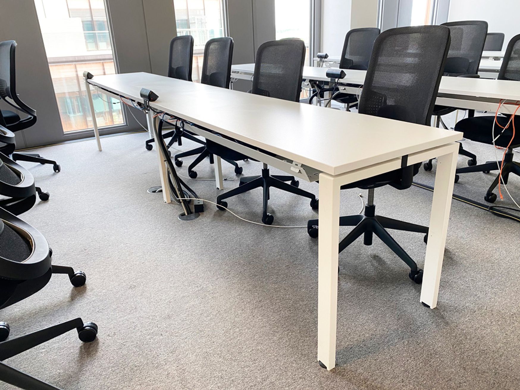 Used 4-person modern white training tables with cable trays
