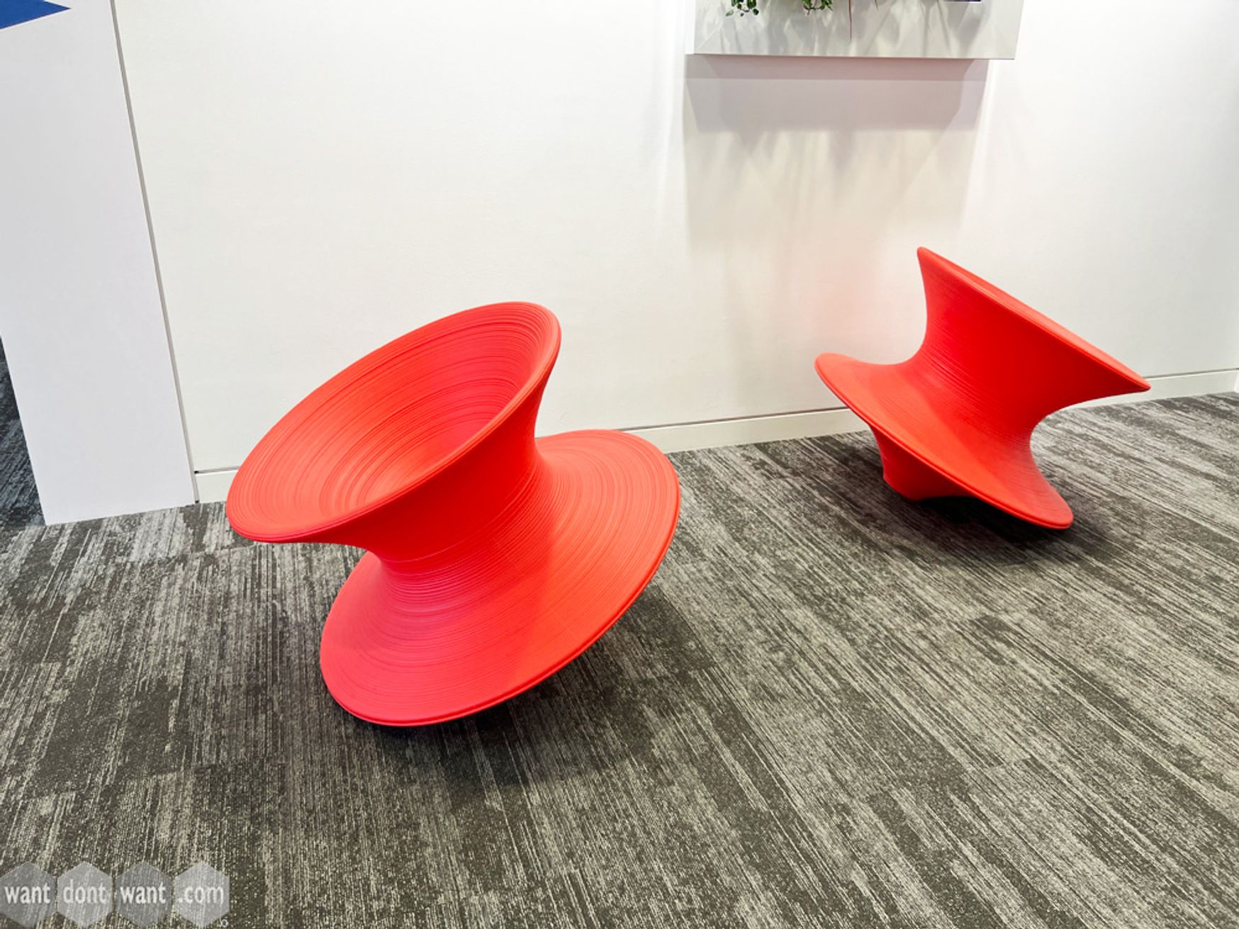 Used Magis 'Spun' chair in red rotational-moulded polythene.