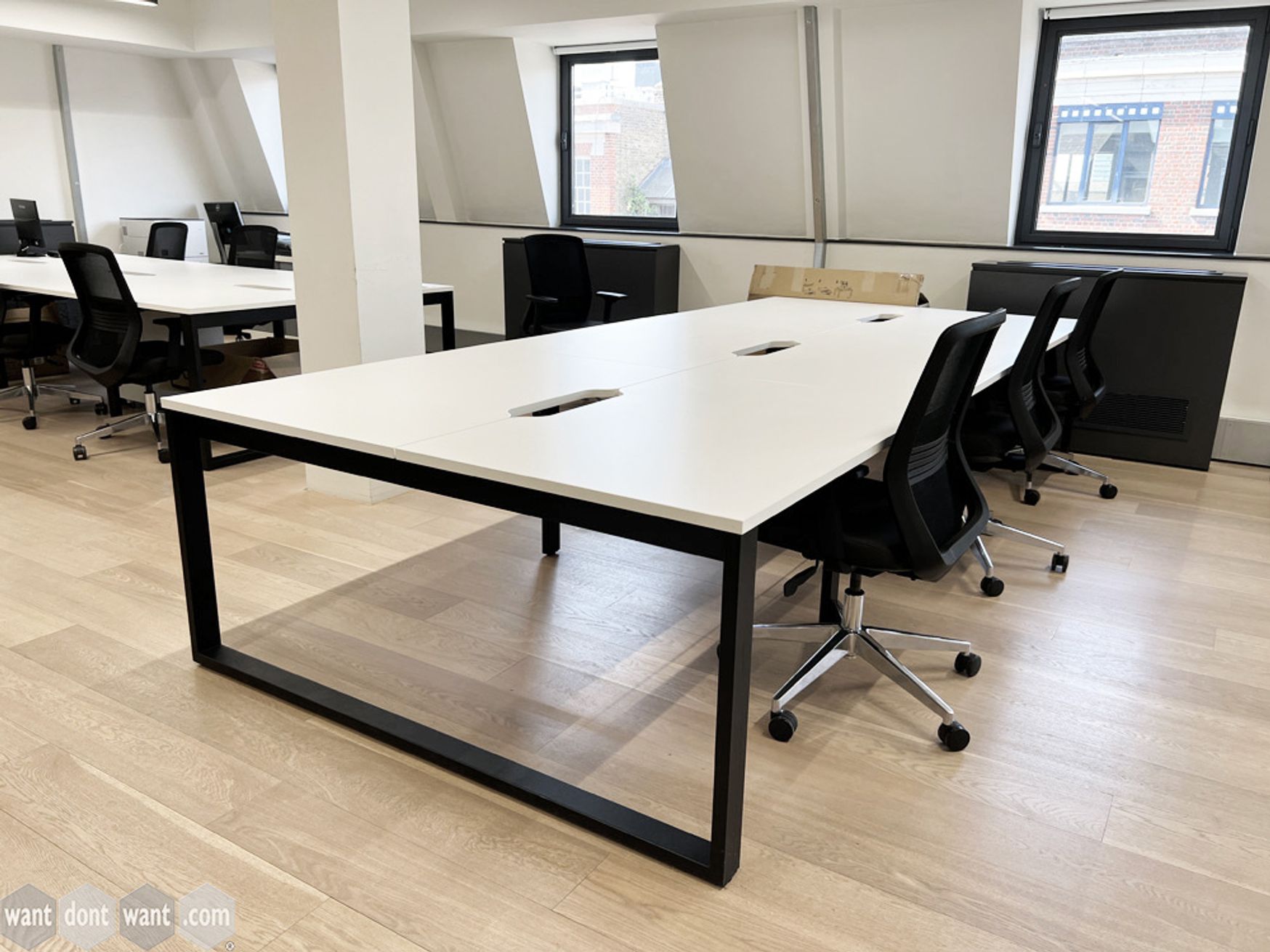 Smart modern used 6-person white bench desk. Each desk position measures 1200mm wide.