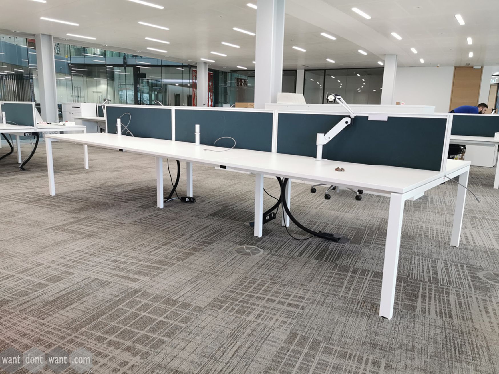 Used 'KI' 1400mm wide white bench desk positions in various configurations.