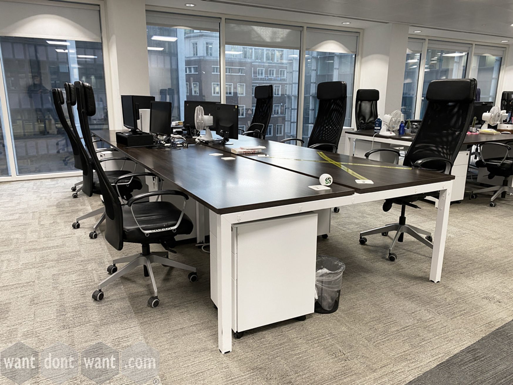 Used desks with walnut MFC tops and white legs in various configurations.