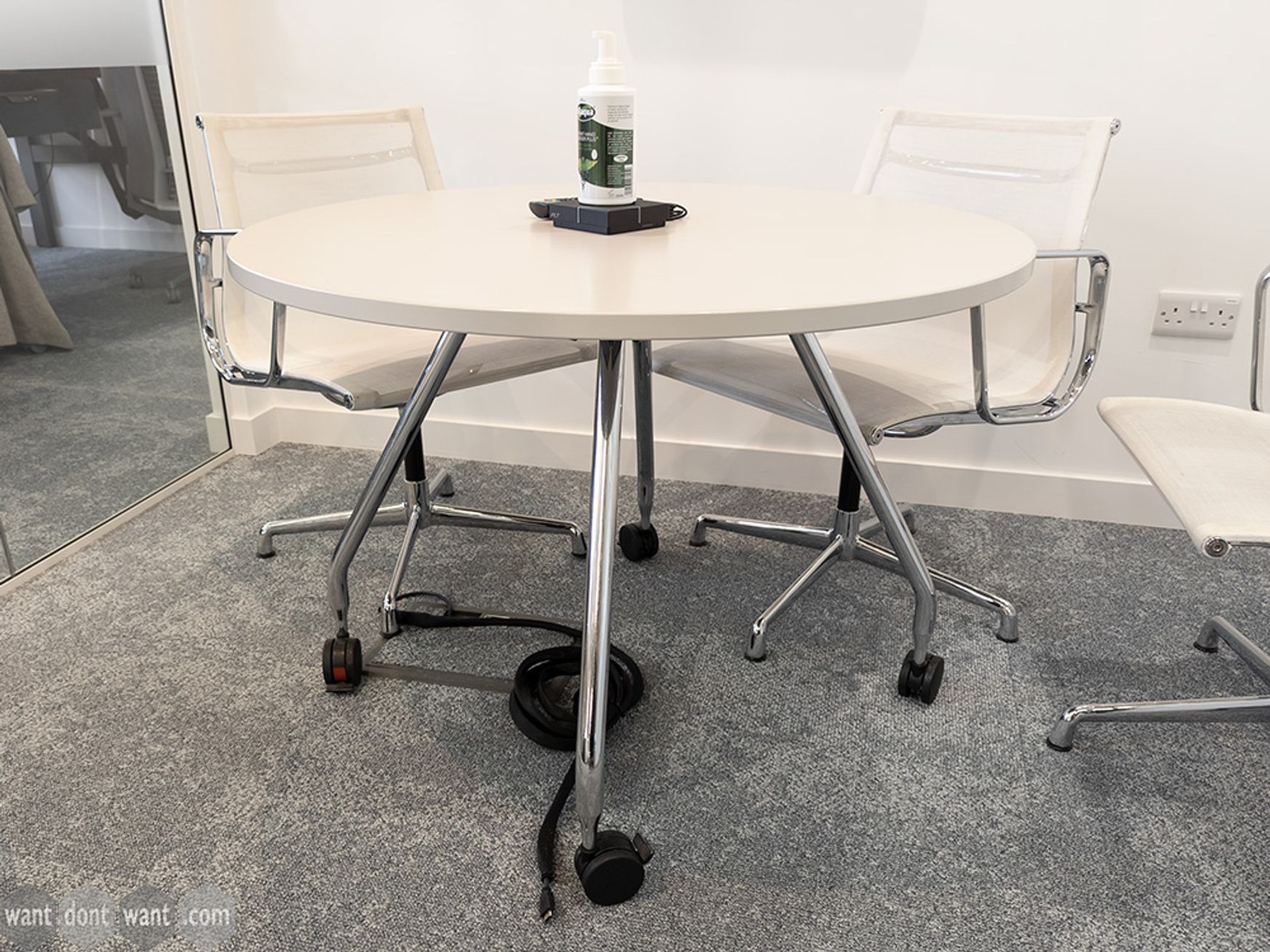 Used 1000mm Vitra circular table on castors with off-white/grey top