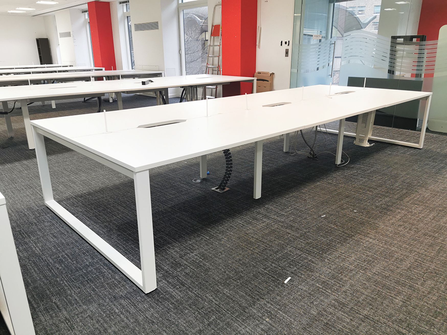 Used 1400mm White Bench Desks available with Red Screens