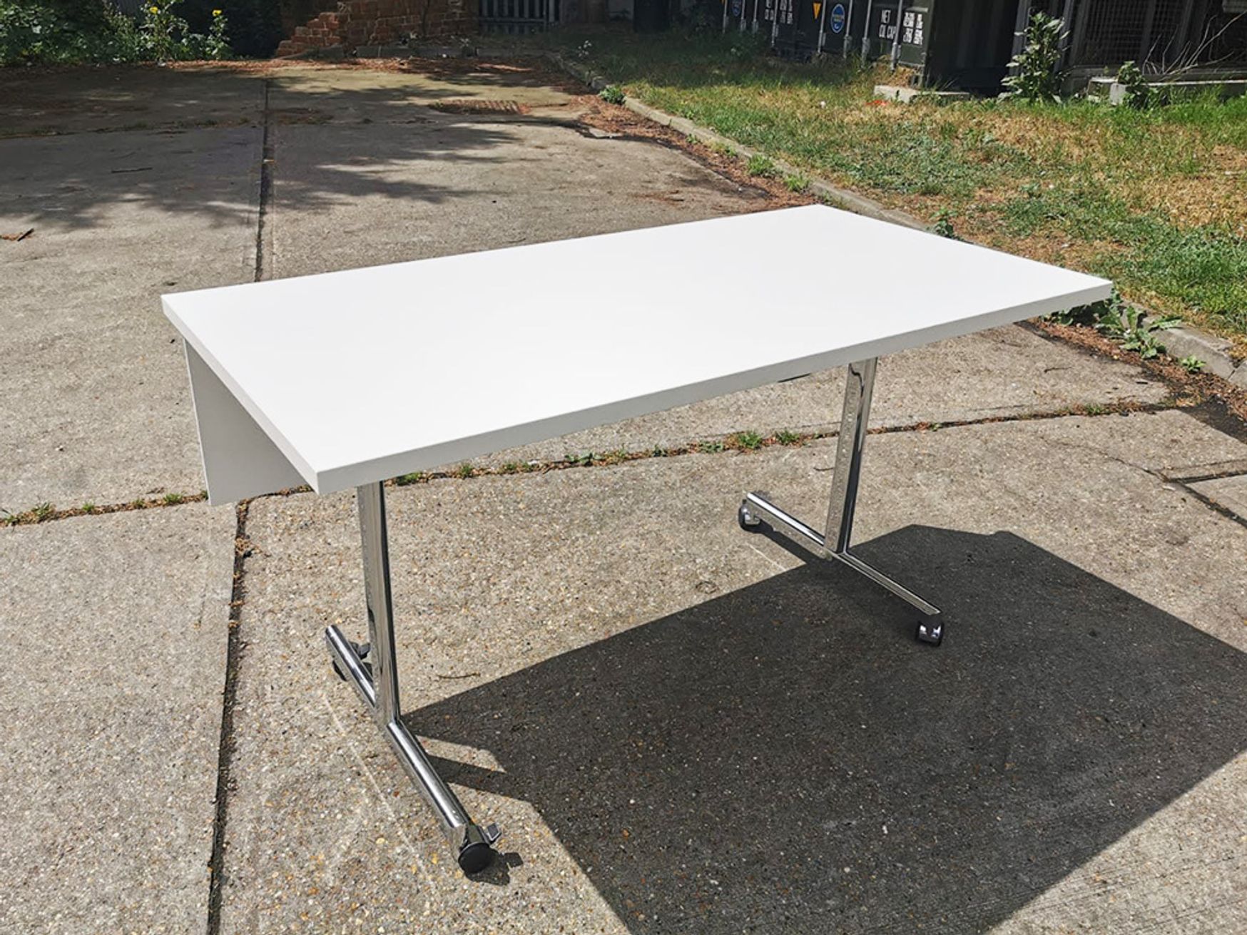 Used 1400mm Brunner flip top folding tables with modesty panel