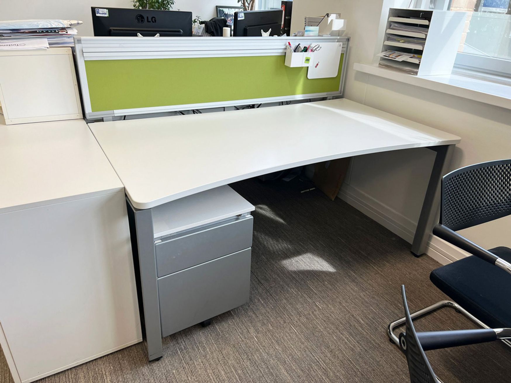 70 x Used 'Steelcase' sliding-top curved front white desks - 1600mm wide. Price includes Steelcase pedestal.