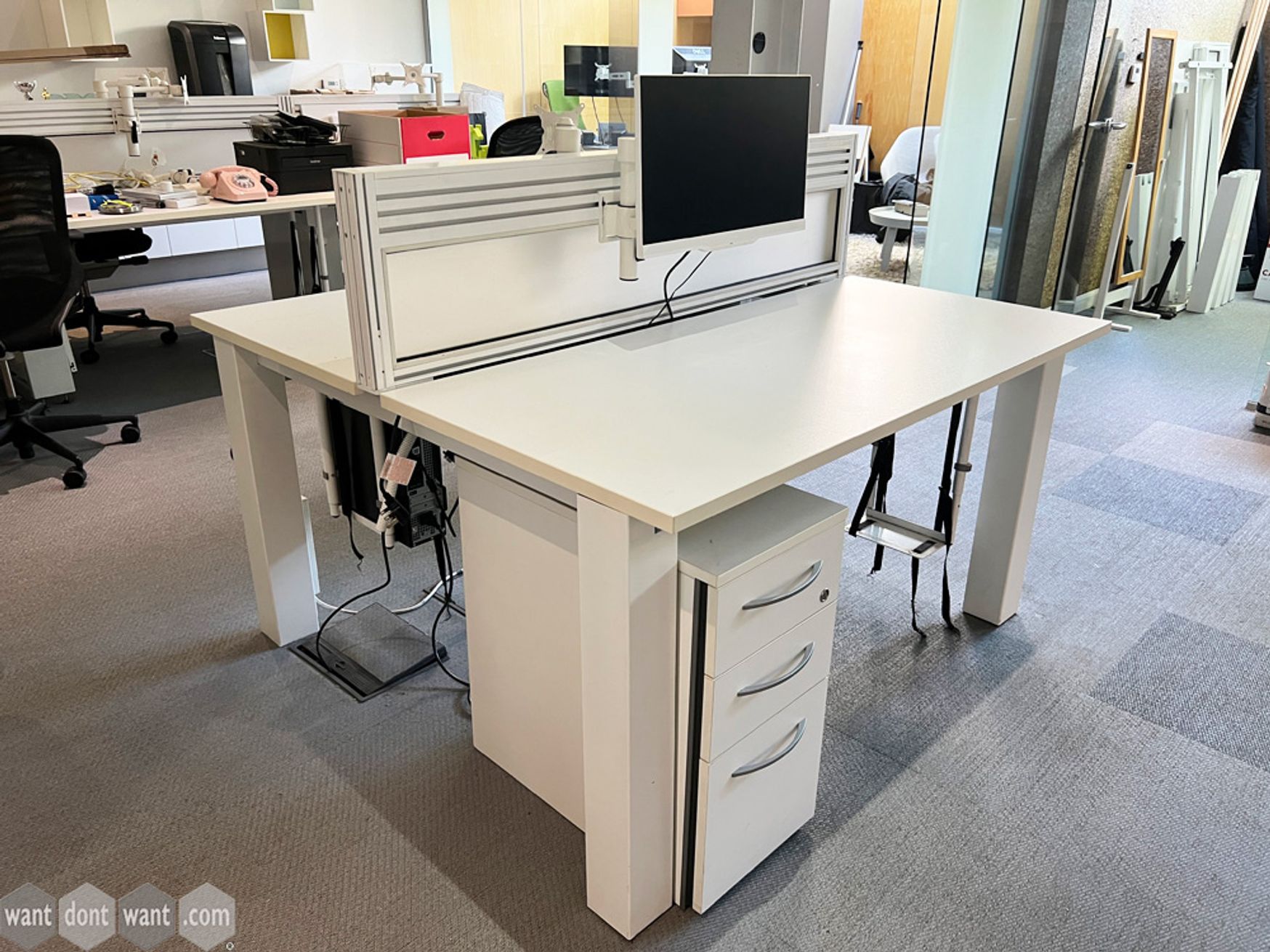 4 x 2-person Sven Christiansen back-to-back white bench desks with screens. 