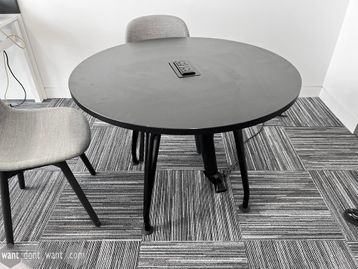 Used 1000mm circular black table with double power sockets