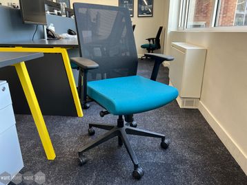 Used mesh-back fully adjustable task chairs with blue upholstered seat.