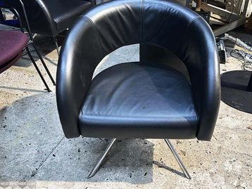 Used Boss Design armchairs upholstered in black leather