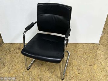 Used meeting chairs upholstered in black leather