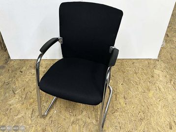 Used meeting chairs upholstered in black fabric