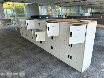 Used Triumph 12-door lockers in white with oak top