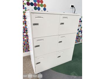 Used 6-section white lockers with combination locks.