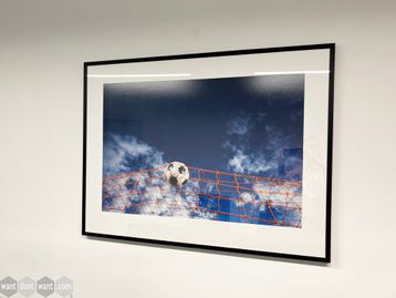 Used Framed photo - football in net above clouds.