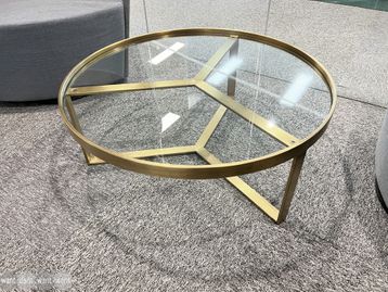Used glass coffee table with brass frame