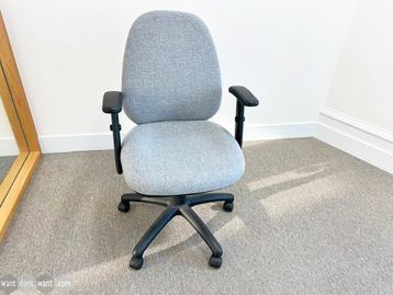 Used fully adjustable task chairs upholstered in light grey fabric.