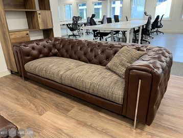 Used sumptuous brown leather Chesterfield sofas.