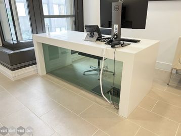 Used Corian white desk with glass modesty panel.