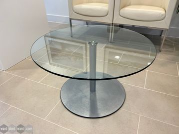 Used circular glass coffee table in excellent condition.