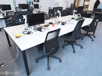 192 x Used 1200mm 'Task Systems' white bench desks with black frames.