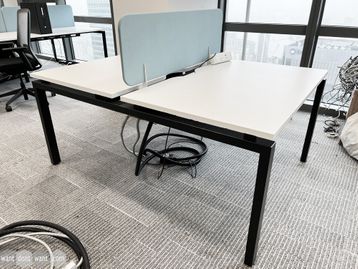 1 x 2-person back-to-back white bench desk with dual monitor arms and power module.