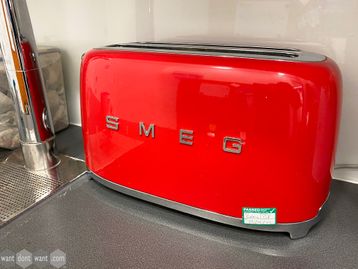 Used 'Smeg' toaster in vibrant red to brighten up your company kitchen.