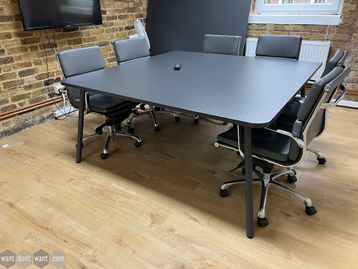 Used charcoal grey meeting table - photo shows one half.