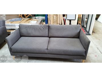 Used 2-seat sofa upholstered in grey fabric