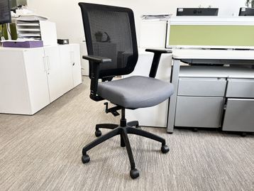 Used Connection Seating fully adjustable task chair with mesh back and grey upholstered seat.